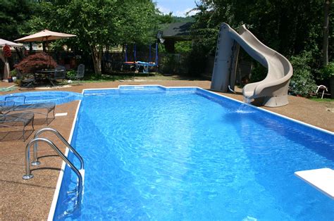 Pool, complete with slide and diving board. | Backyard pool, Pools ...