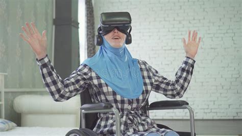 Woman In Hijab Wheelchair Uses Vr Glasses 3d Technology Stock Image Image Of Happy Looking
