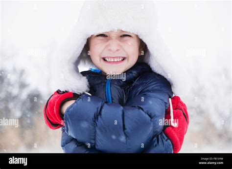 Cute Little Girl Wearing Winter Hat And Gloves Posing Stock Photo