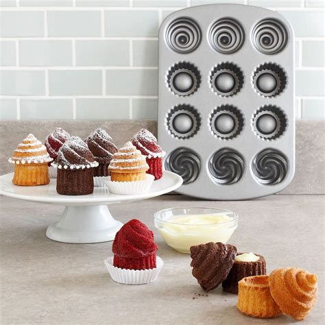 Assuming that you have the cupcake pan already lined with cupcake liners, you are ready for this next part of filling the cupcake liners. I love this...can't wait to try it! Nordic Ware min filled ...