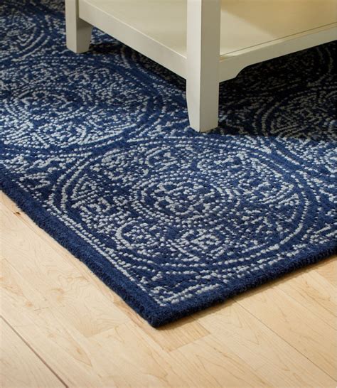 Crafted from polypropylene yarns, you will enjoy the soft, plush texture under your feet. Floral Circle Wool Tufted Rug, Navy | Tufted rug, Rugs, Capel