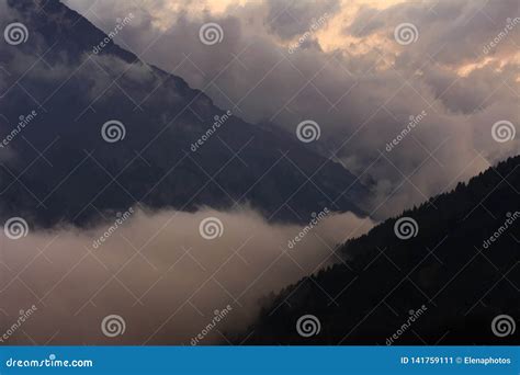 Beautiful Foggy Sunset Over The Mountains Alps Stock Image Image Of