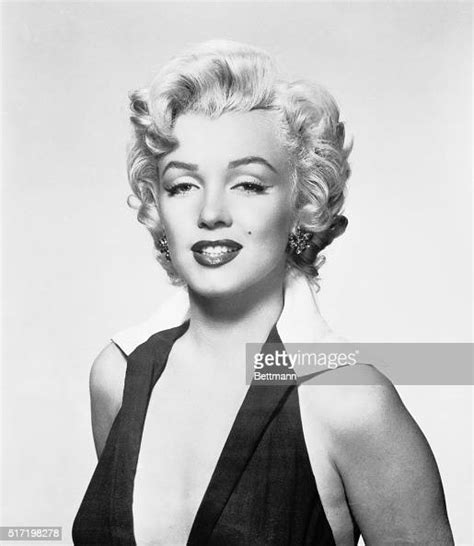 Marilyn Monroe Wearing A Halter Dress In The Shot Made Famous By
