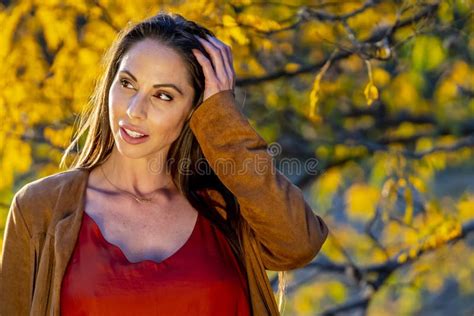 A Lovely Brunette Model Poses Outdoor While Enjoying The Fall Weather Stock Image Image Of