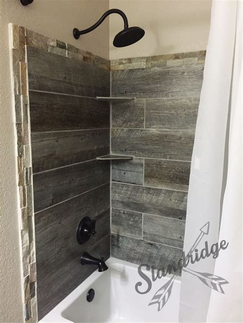 Introduce a natural element to your bath with resilient. rustic bathroom - barnwood ceramic tile. | Rustic bathroom ...