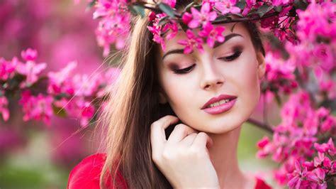 Girl Model Is Wearing Dress Standing Under Pink Flowers Trees Branches