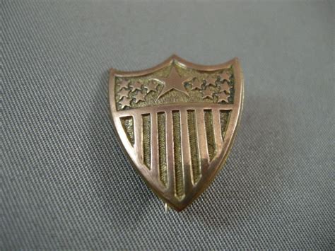 Vintage American Shield Brass Lapel Badgepin
