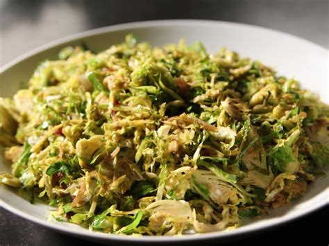 Roasted with olive oil, salt and pepper, the sprouts and the pancetta crisp up in unison, the fat from the pancetta flavor the sprouts, and its crispy surface emerges glistening and caramelized. Shaved Brussels Sprouts with Pancetta Recipe | Ina Garten | Food Network