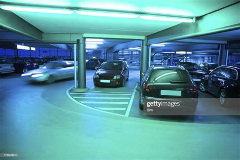 Illuminated Parking Garage With Cars High Res Stock Photo Getty Images