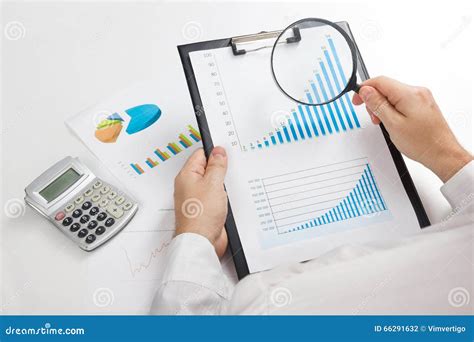 Businessman Counting Losses And Profit Working With Statistics