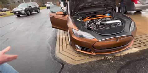 V8 Powered Tesla Takes Gas On The Side Of The Road On Its Way To First