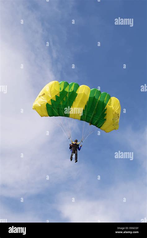 One Day With Parachutist In Airfield The Skydiver Landing Under Green