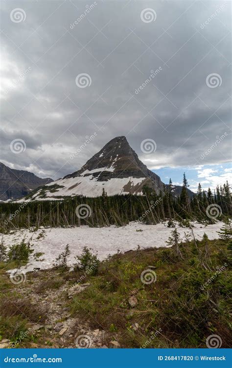 Amazing Shot Of A Mountain Covered In Snow In Glacier National Park In