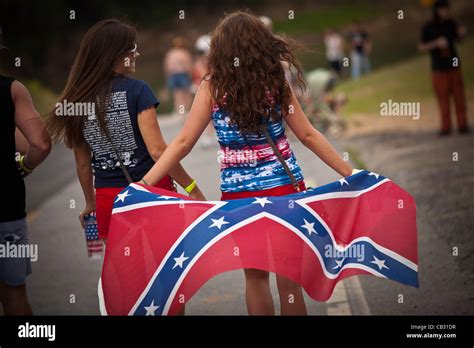 Two Young Women With A Confederate Flag At The Summer Redneck Games On