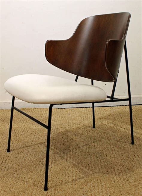 Maybe you would like to learn more about one of these? IB Kofod Larsen Penguin Chair at 1stDibs