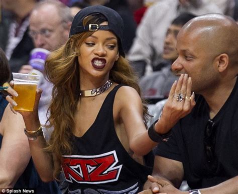 Rihanna Gets Flirty With A Male Companion At The Basketball After