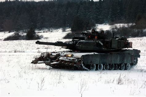 A Green Abrams In The Snow With A Mine Plow Cant Get Much Better