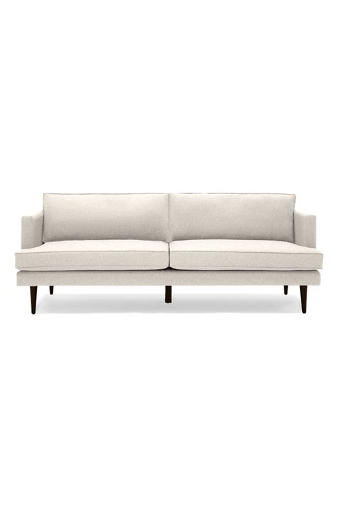 Sleek Lines And Tapered Legs Create A Timelessly Sophisticated Sofa