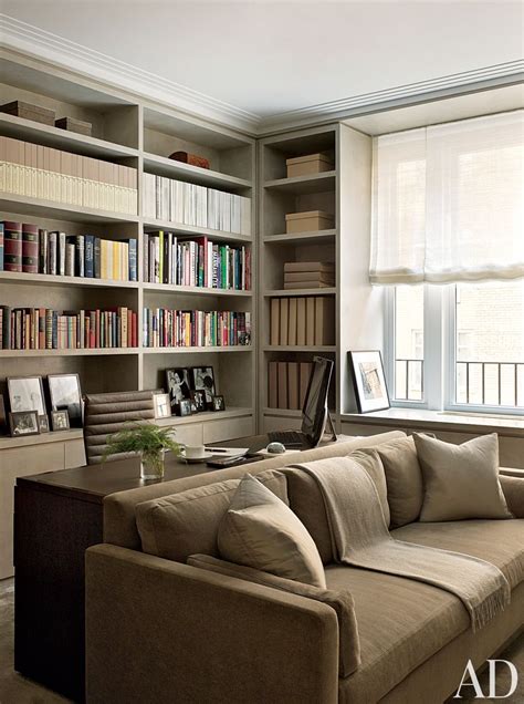 In A Cozy New York Library The Sofa Is Covered In A Neutral Velvet
