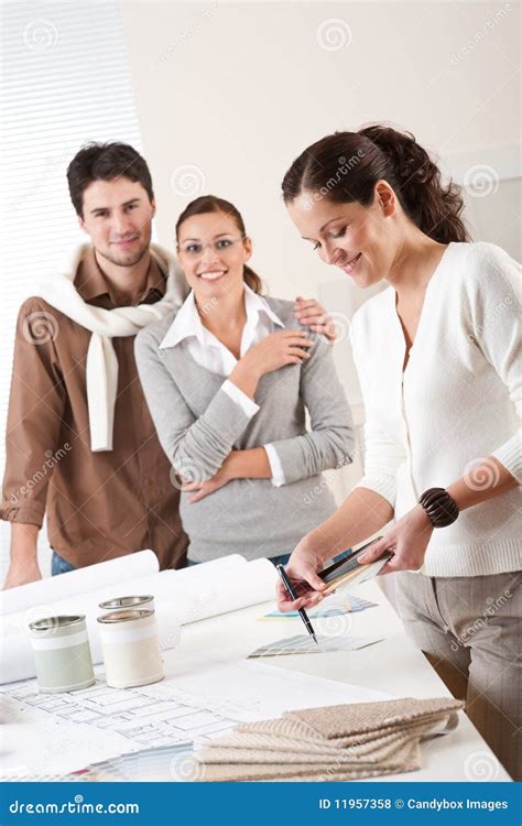 Female Interior Designer With Two Clients Stock Photo Image Of Office
