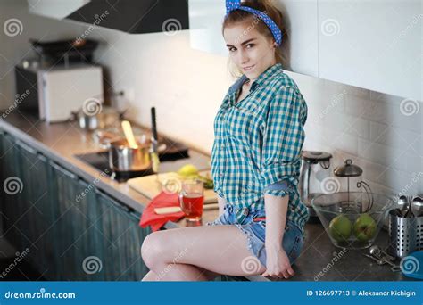 A Cute Young Girl In The Kitchen Prepares Food Stock Image Image Of