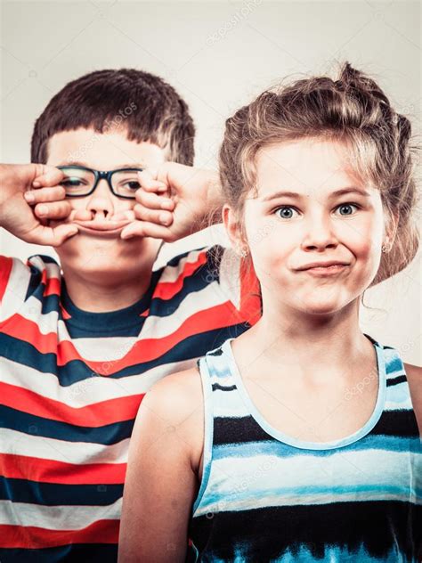 Kids Little Girl And Boy Making Silly Face Expression Stock Photo By