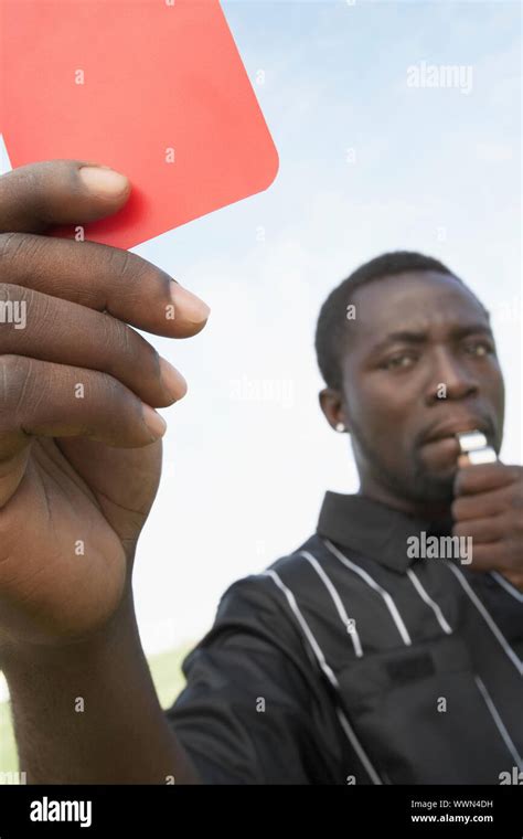 Soccer Referee Holding Out A Red Card Stock Photo Alamy