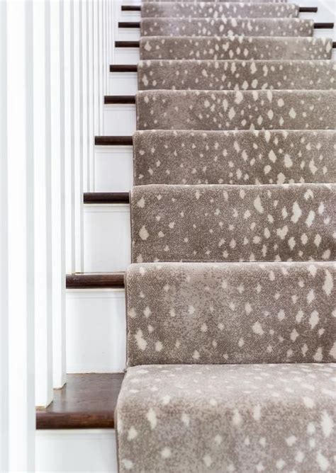 Afterward, to… continue reading → A gray animal print stair runner accents a white staircase boasting stained wood treads and ...