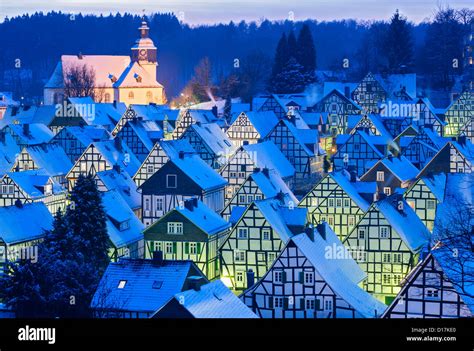 Winter Evening View Of Snow Covered Old Houses In Freudenberg