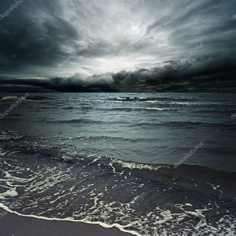 Stormy Clouds Over Dark Ocean — Stock Photo © Nejron 10214940