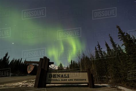The Aurora Borealis Northern Lights Dancing Above The Sign Marking