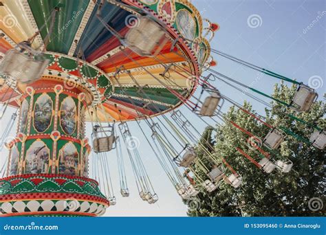 Carousel With Chains In An Amusement Park On A Summer Sunny Day Stock
