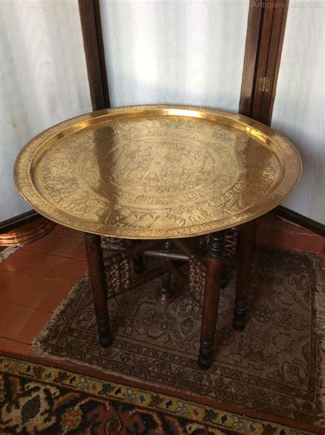 For a natural take, opt for wood, or go with brass, chrome or gold to bring some shine to the space. Benares Brass Top Coffee Table - Antiques Atlas