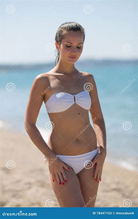 attractive girl in white bikini on seashore stock image image of people european 78447153