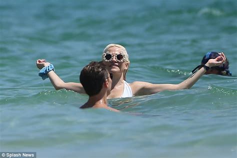 Pixie Lott Frolics In The Sea In White Lace Up Swimsuit Daily Mail Online