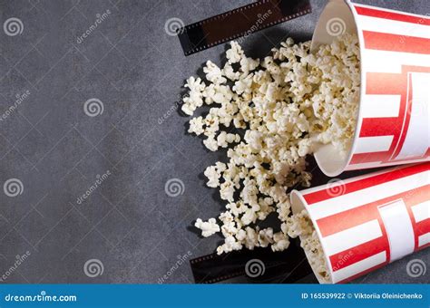 Top View Of Popcorn In The Big Buckets Film Stocks On The Grey Surface