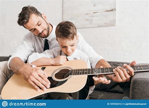 Dad Teaching Son To Play Acoustic Guitar Stock Photo Image Of