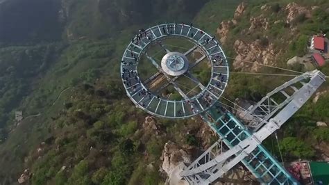 The tourist was trapped 100 metres above ground after glass panels in the piyan mountain bridge fell out during high winds. This glass walkway in China is crazy - YouTube