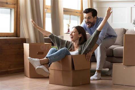 happy couple have fun on moving day to new home stock image image of activity game 169721869