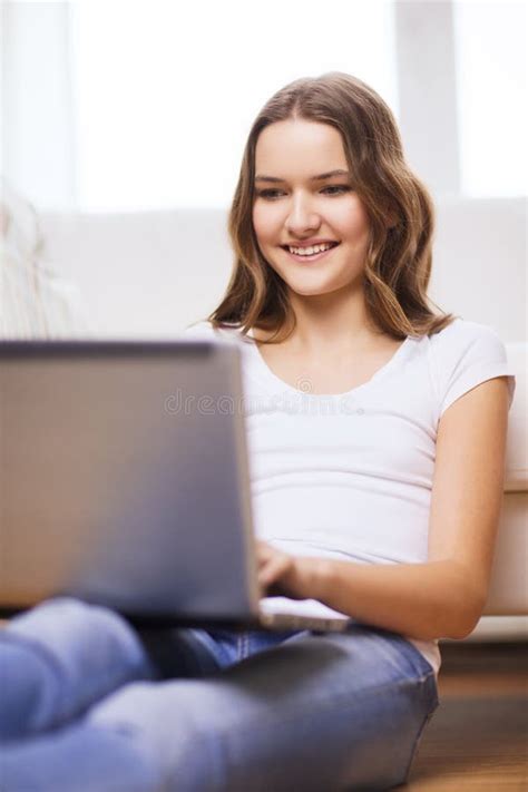 Smiling Teenage Girl With Laptop Computer At Home Stock Photo Image