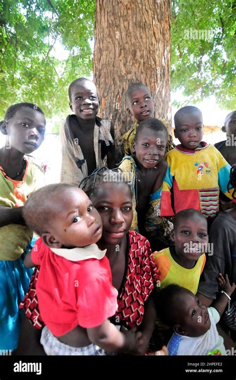 Burkinabe Children Smiling At The Camera In A Small Village In Central