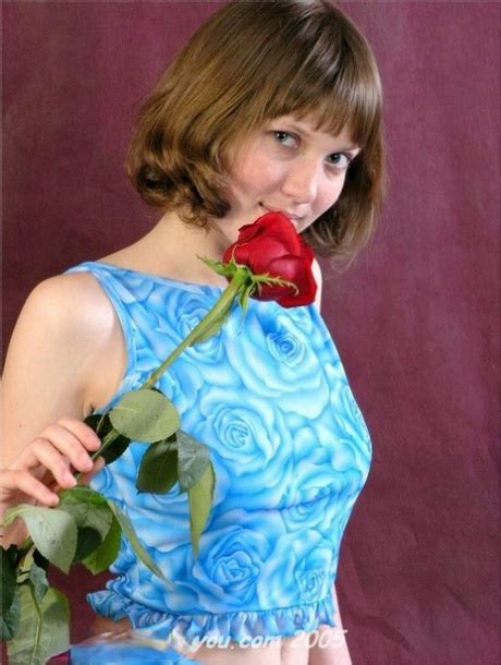 Charming Teen Anabell Holds A Solitary Red Rose While Taking Off Her Clothes Nakedpics