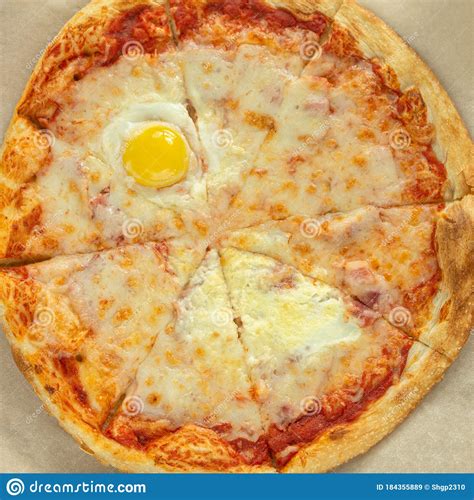 A Whole Carbonara Pizza Is Located On A Brown Background View From Above Stock Image Image Of