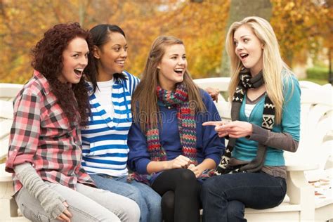 Group Of Four Teenage Girls Sitting On Bench Stock Image Image 13671297