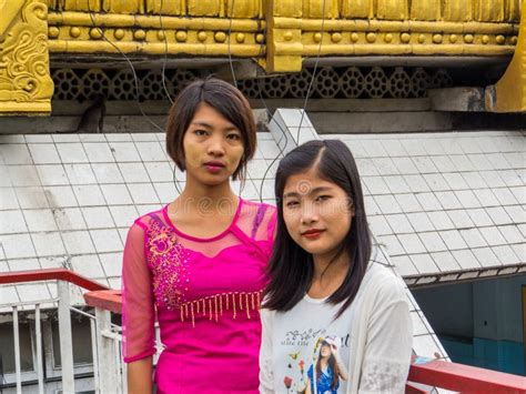 Two Burmese Girls Walking Towards A Temple In Bagan Myanmar Burma