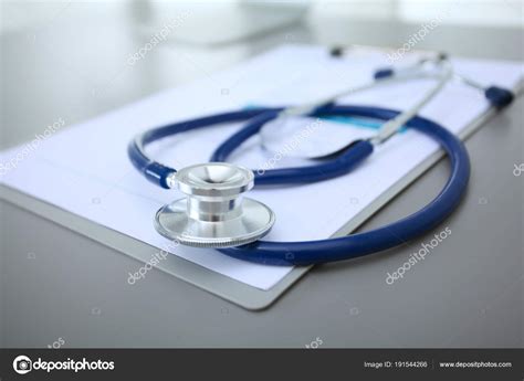 Medical Equipment Blue Stethoscope And Tablet On White Background