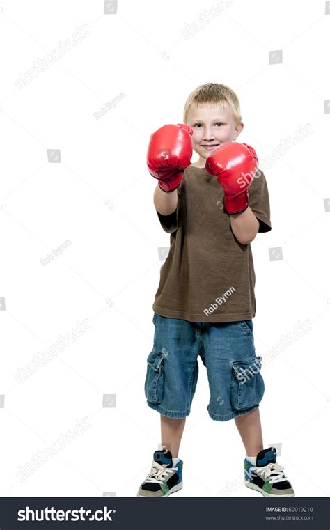 A Little Boy Wearing A Pair Of Boxing Gloves Stock Photo 60019210
