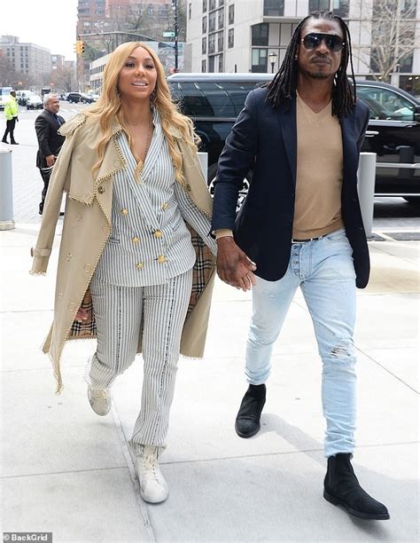 Tamar Braxton Looks Chic In A Pinstripe Suit As She Walks Hand In Hand