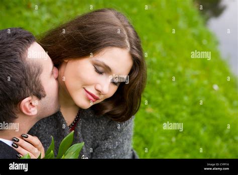 Two Young Lovers Enjoying Each Other In Park Stock Photo Alamy