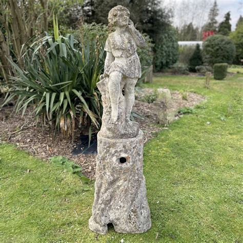 An English Composition Stone Figural Garden Statue Of A Girl Lassco